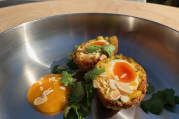 Smoked Haddock Scotch Egg served in a ProWare pan on a garden table in a sunny garden