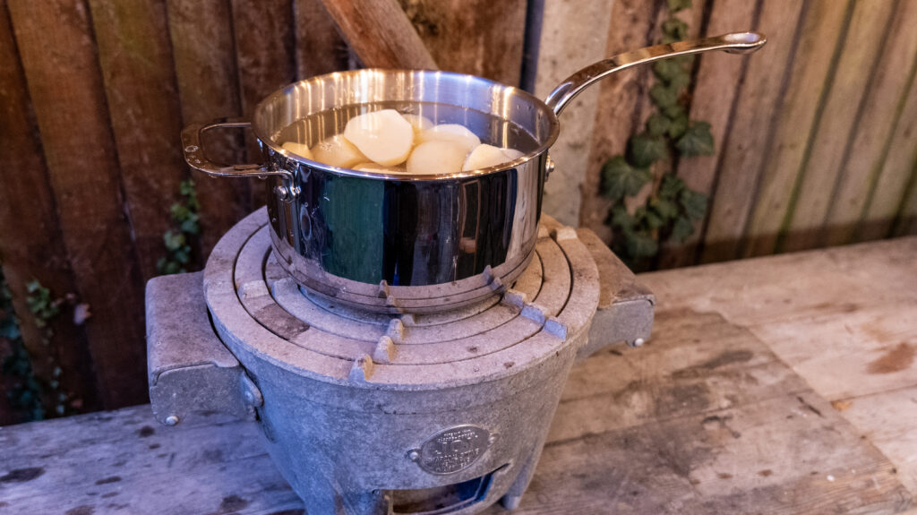 Potatoes par boiling in a ProWare stainless steel saucepan for Burns Night Haggis Kebabs with a Honey and Whisky Glaze, Smashed Neeps and Tatties